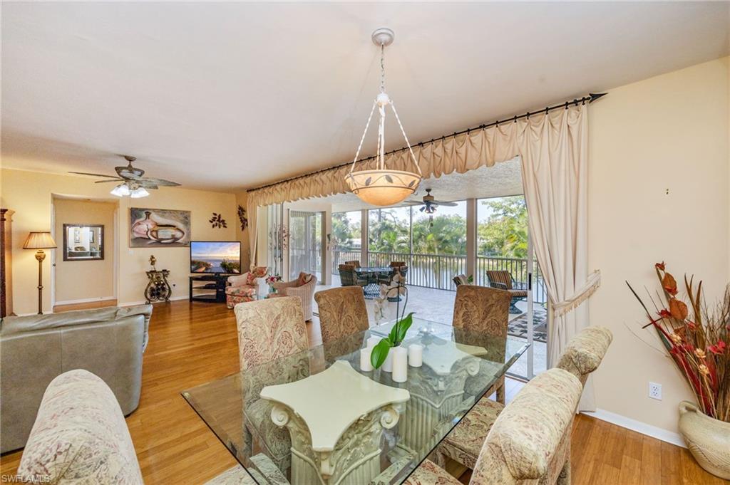 Dining room with a ceiling fan and light wood-style flooring