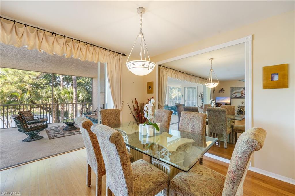 Dining area with light wood-style floors