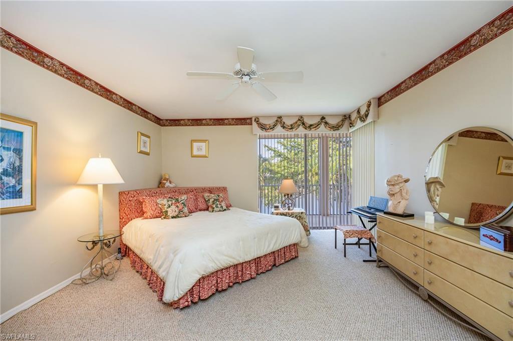 Bedroom with carpet, a ceiling fan, and access to outside