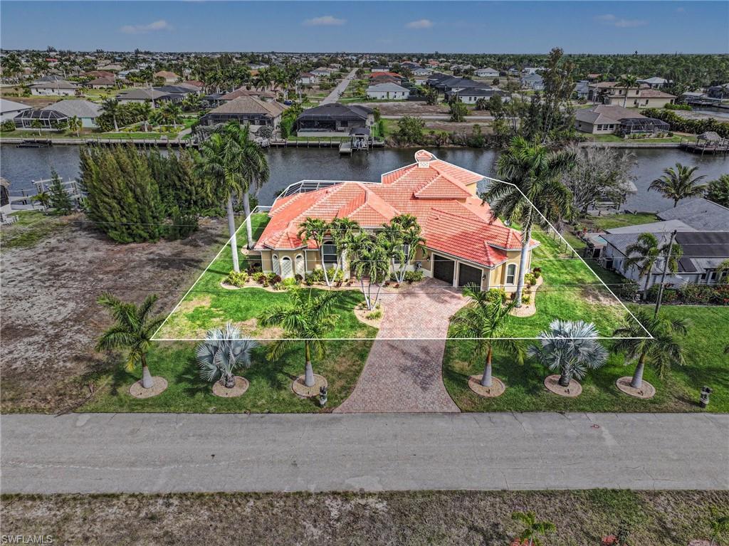 Aerial perspective of suburban area with a nearby body of water