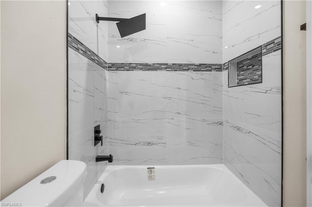 Full bathroom with bathtub / shower combination and toilet