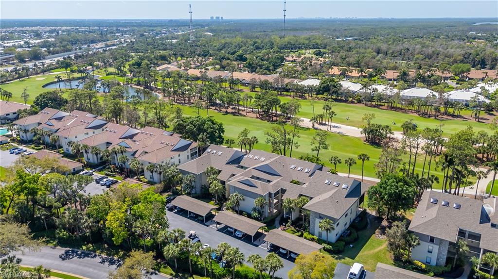 Aerial overview of property's location featuring nearby suburban area