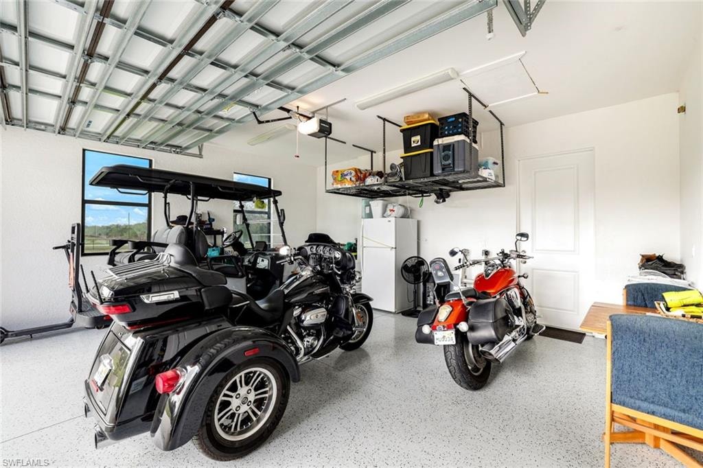 Garage with freestanding refrigerator