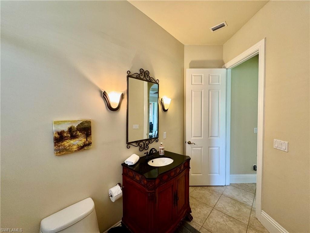 Bathroom with vanity and light tile patterned floors