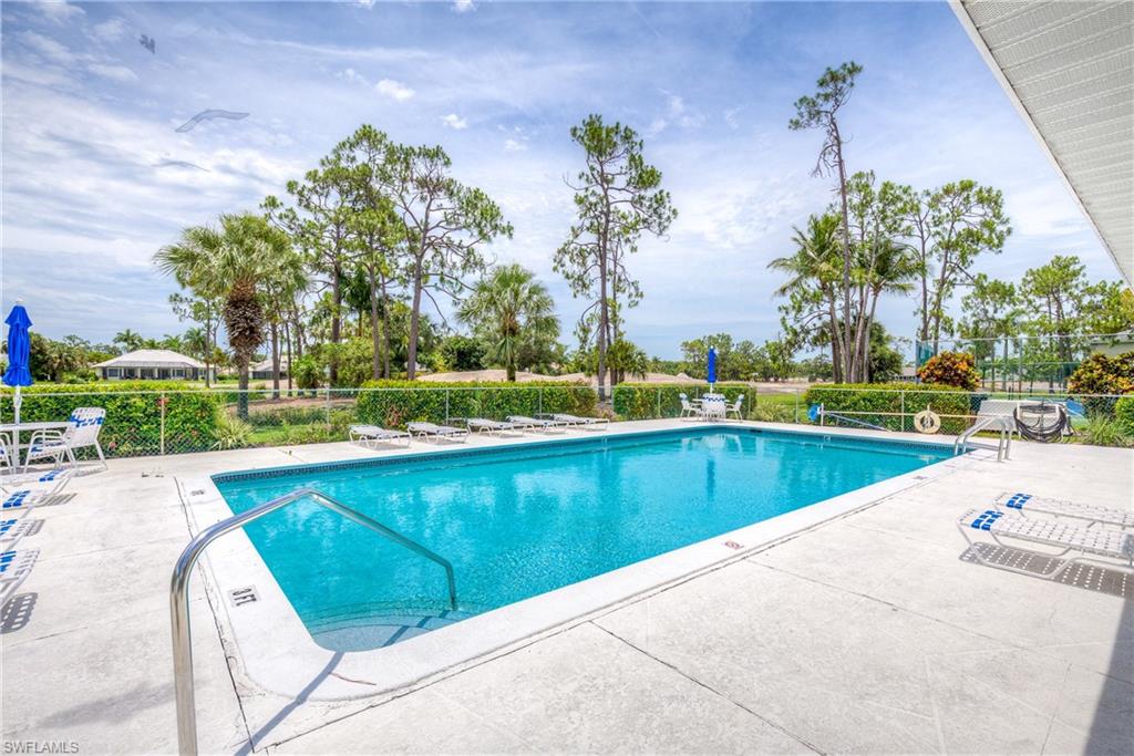 Community pool featuring a patio area