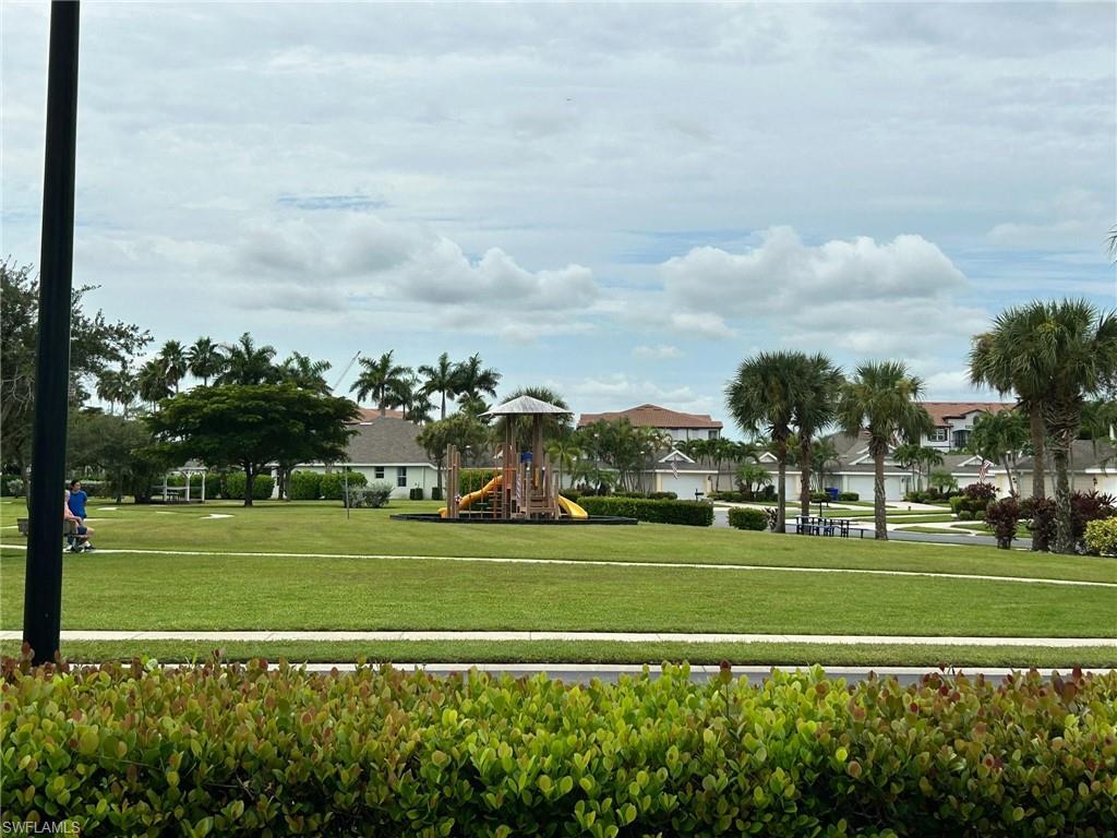View of community featuring a lawn