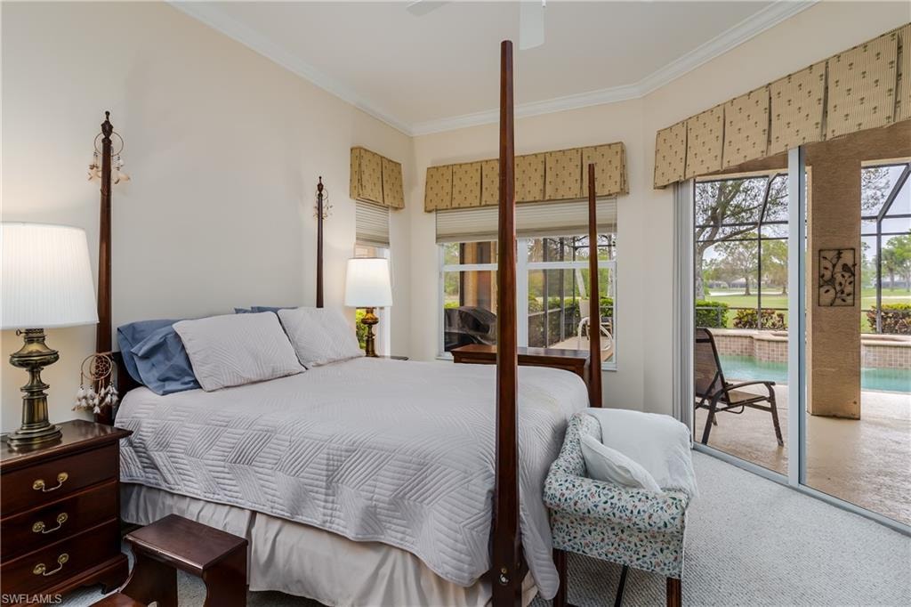 Carpeted bedroom with multiple windows, access to exterior, ceiling fan, and crown molding