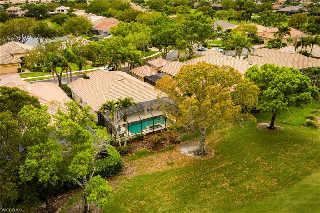 Aerial perspective of suburban area with a pool