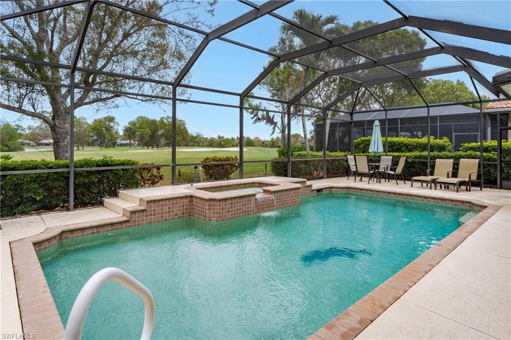 Integrated pool / hot tub with a lanai, a patio area, view of golf course, and a sunroom