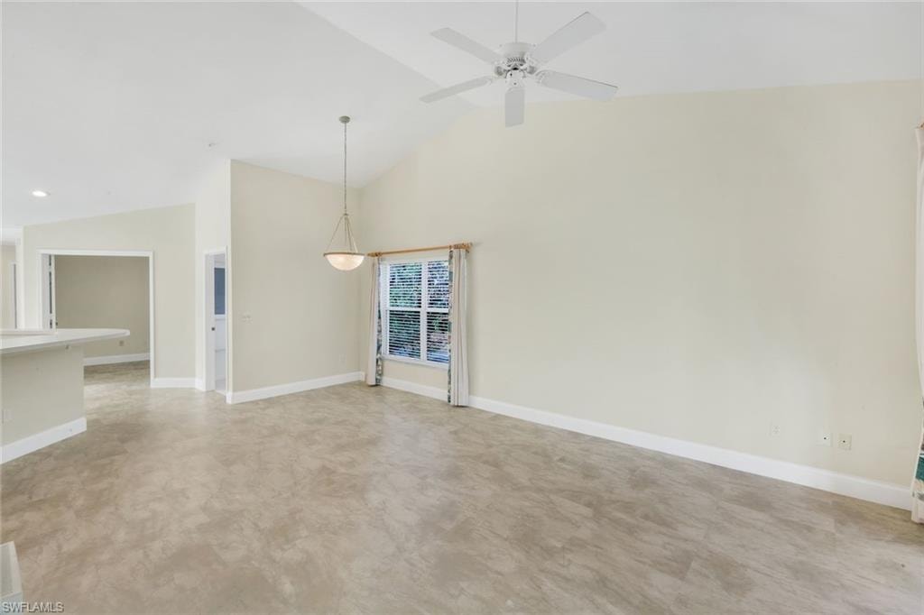 Spacious living room with vaulted ceiling.