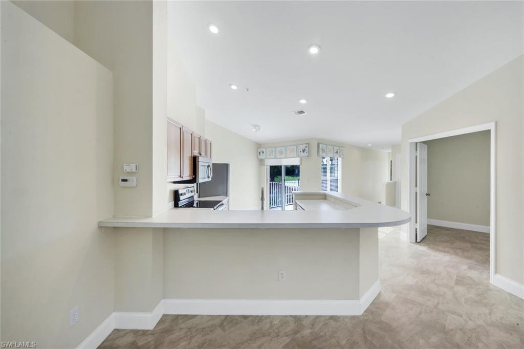 Kitchen with breakfast bar.