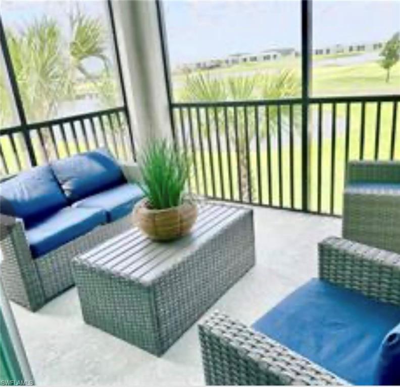 Sunroom / solarium with an outdoor living space