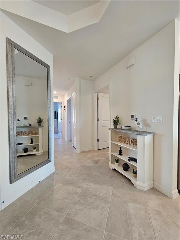 Hallway featuring baseboards