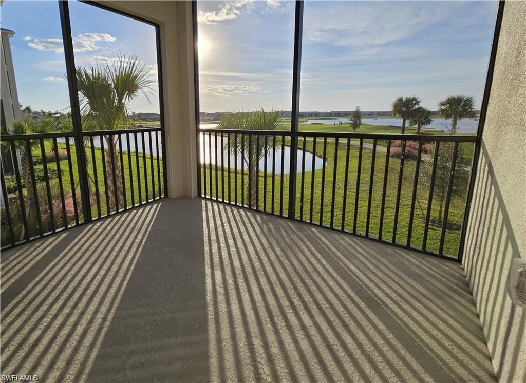 Sunroom with a water view and a healthy amount of sunlight