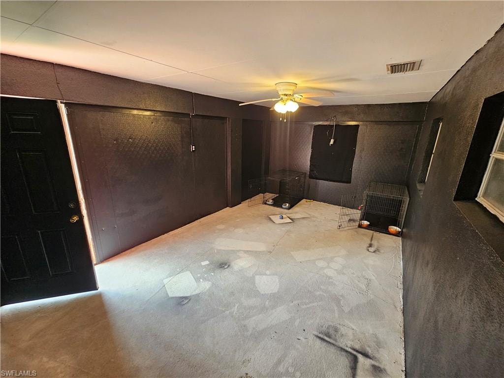 Spare room featuring ceiling fan and heating unit