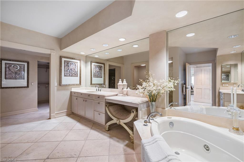Master Bathroom featuring vanity, a bath, and recessed lighting