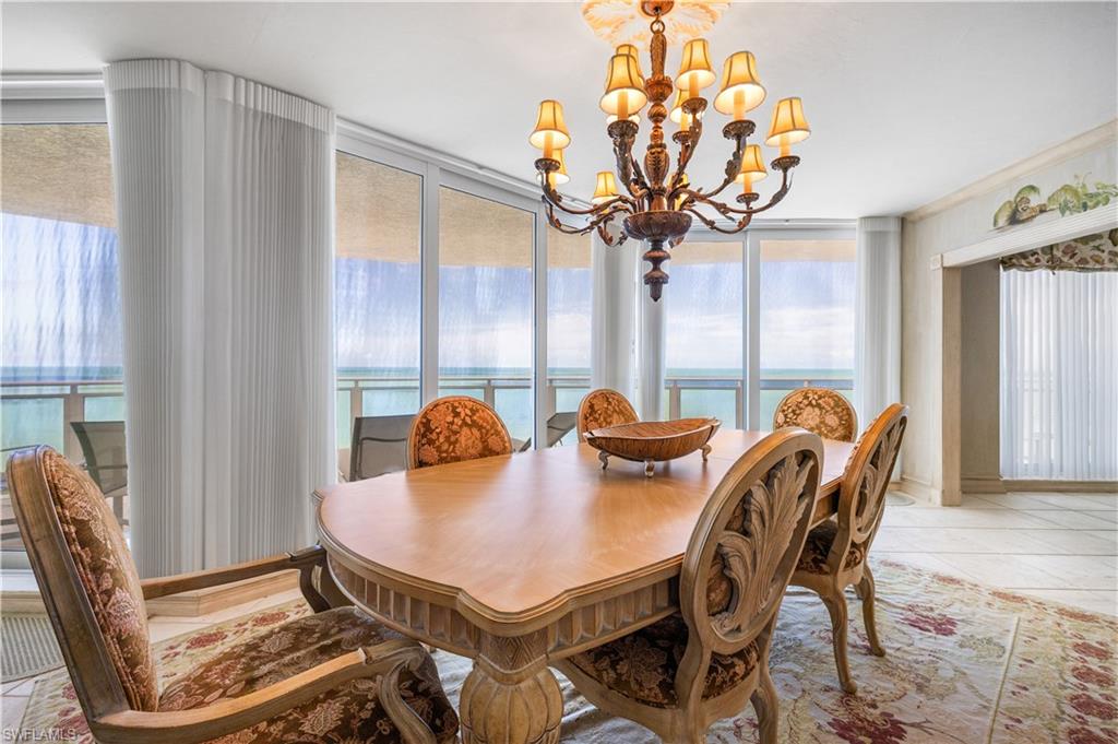 Dining room featuring hanging lights and light tile patterned flooring