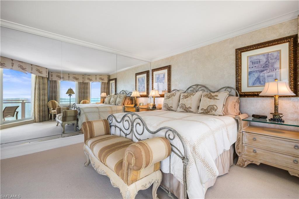 Master Carpeted bedroom with crown molding