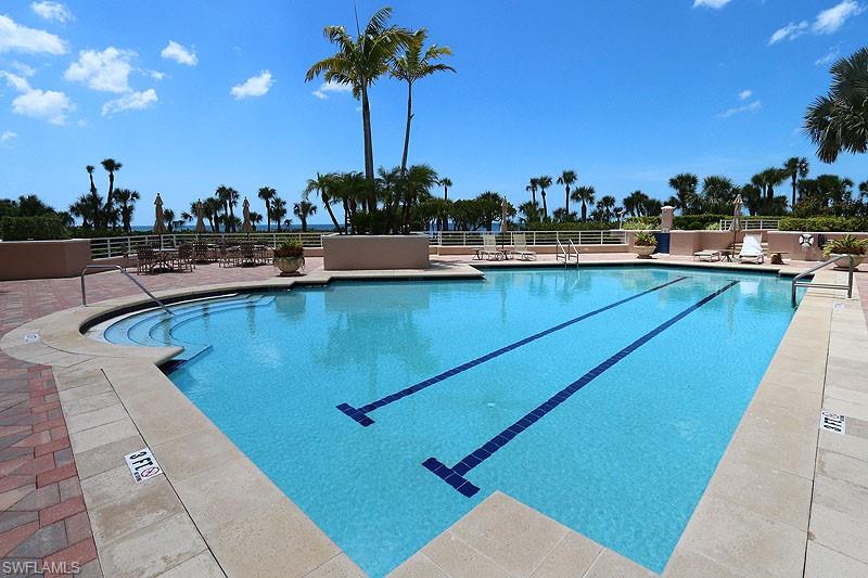 Community pool with a patio