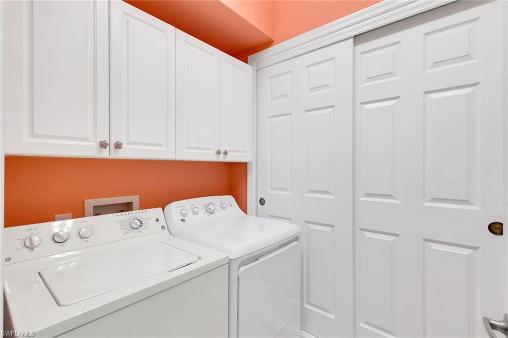 Utility room with cabinetry storage above!
