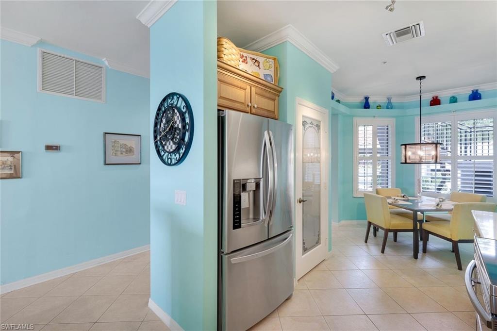 French Door Refrigerator, Glass Pantry Door, Crown Molding Detail, Plantation Shutters, and Updated Dining Room Light Fixture!