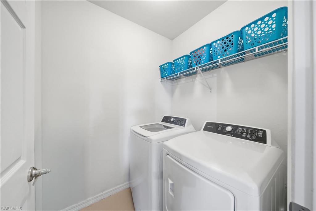 Laundry room with washing machine and dryer