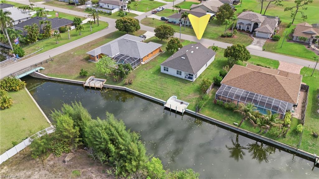 Aerial perspective of suburban area with a large body of water