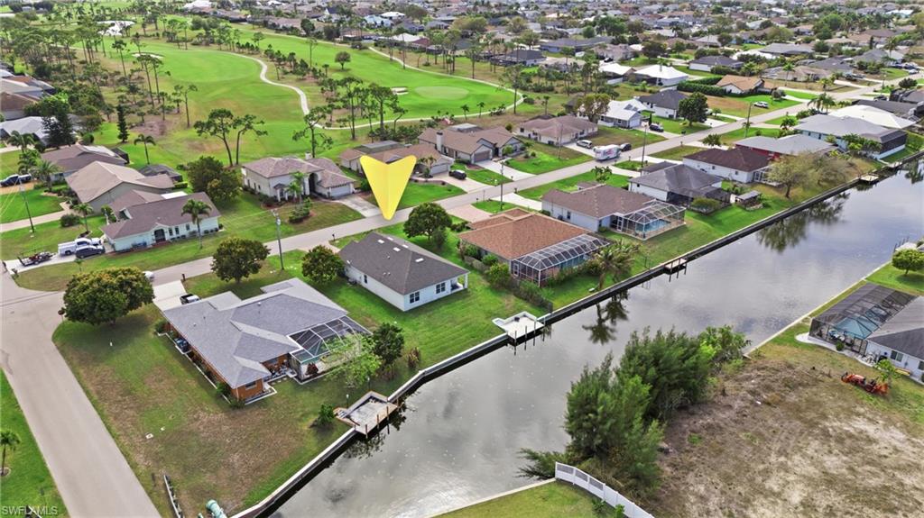 Aerial view of residential area with a golf course