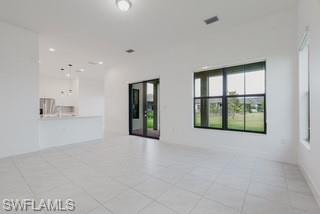 Spare room featuring light tile patterned flooring