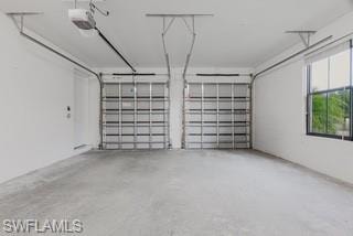 Garage featuring a garage door opener