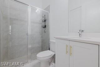 Bathroom featuring a stall shower and vanity