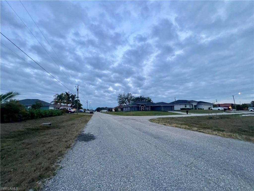 View of asphalt road with a residential view