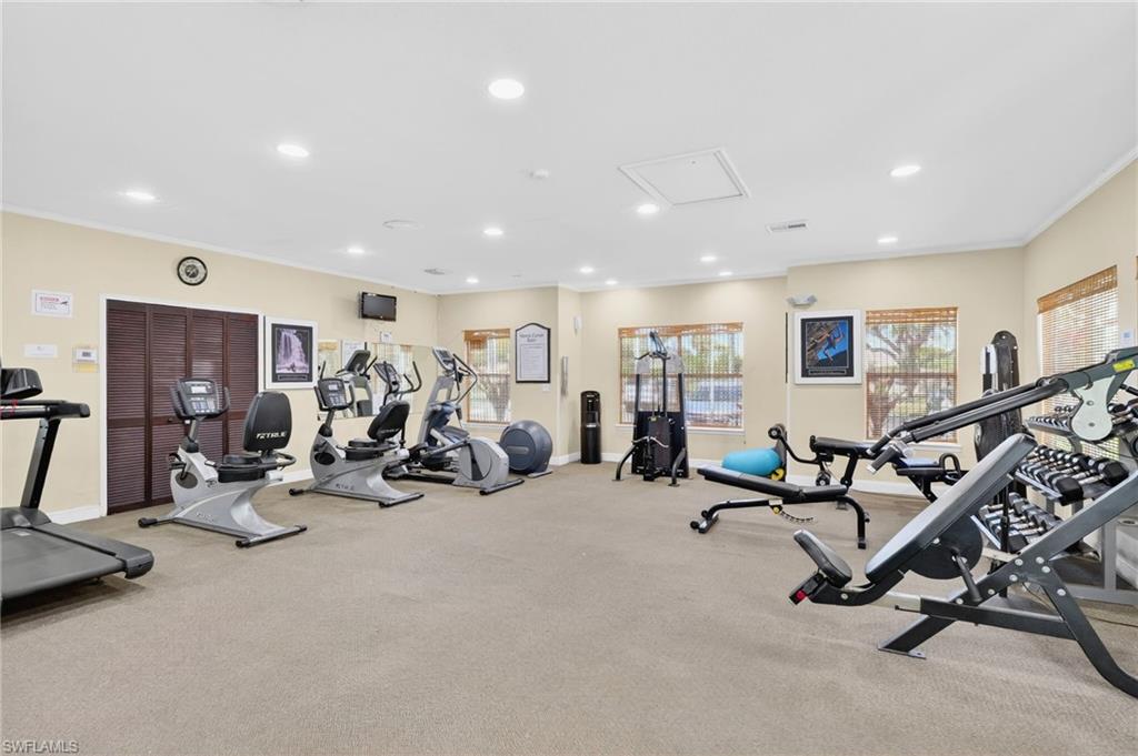 Exercise room with recessed lighting and ornamental molding