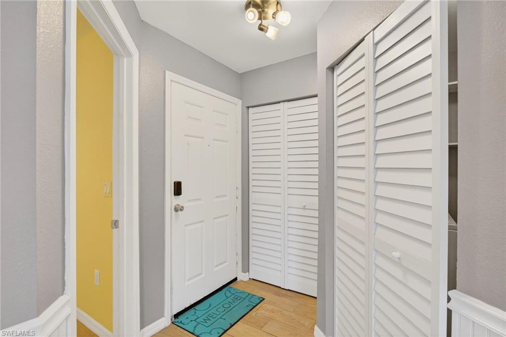 Entryway featuring light wood-type flooring and baseboards