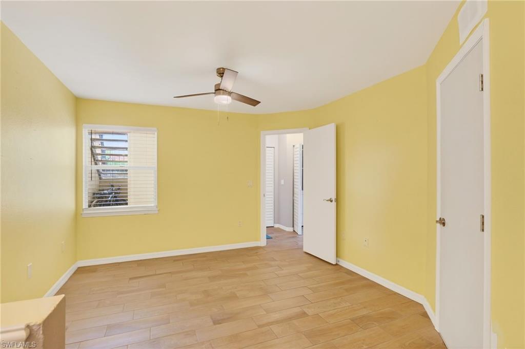 Unfurnished bedroom with light wood-type flooring and ceiling fan