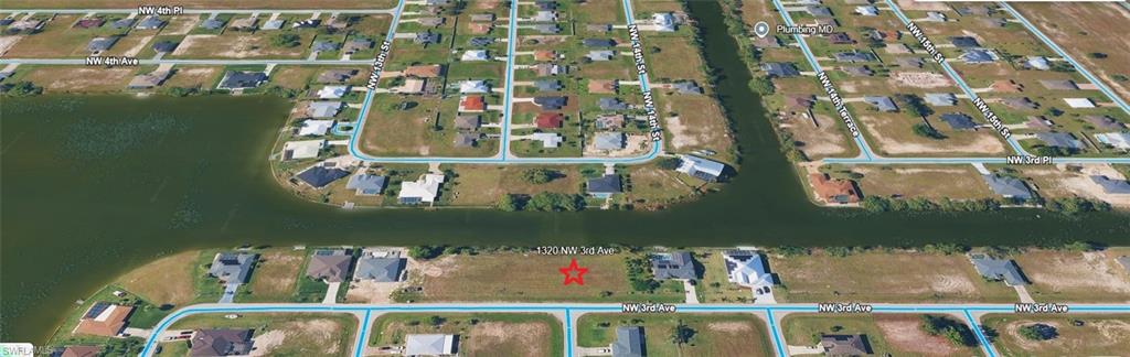 Aerial perspective of the property and the surrounding canals and lake.