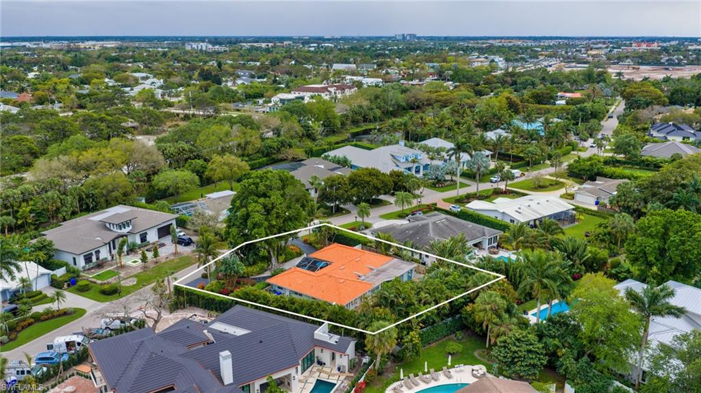 Aerial perspective of suburban area featuring property parcel outlined