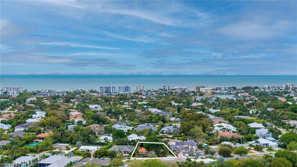 View of urban area featuring property boundaries highlighted, a nearby body of water, and nearby suburban area