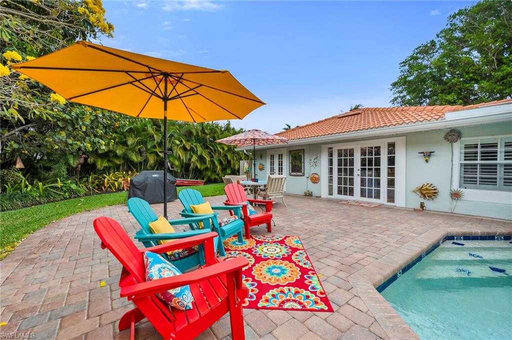 View of patio / terrace featuring grilling area, a pool, and french doors