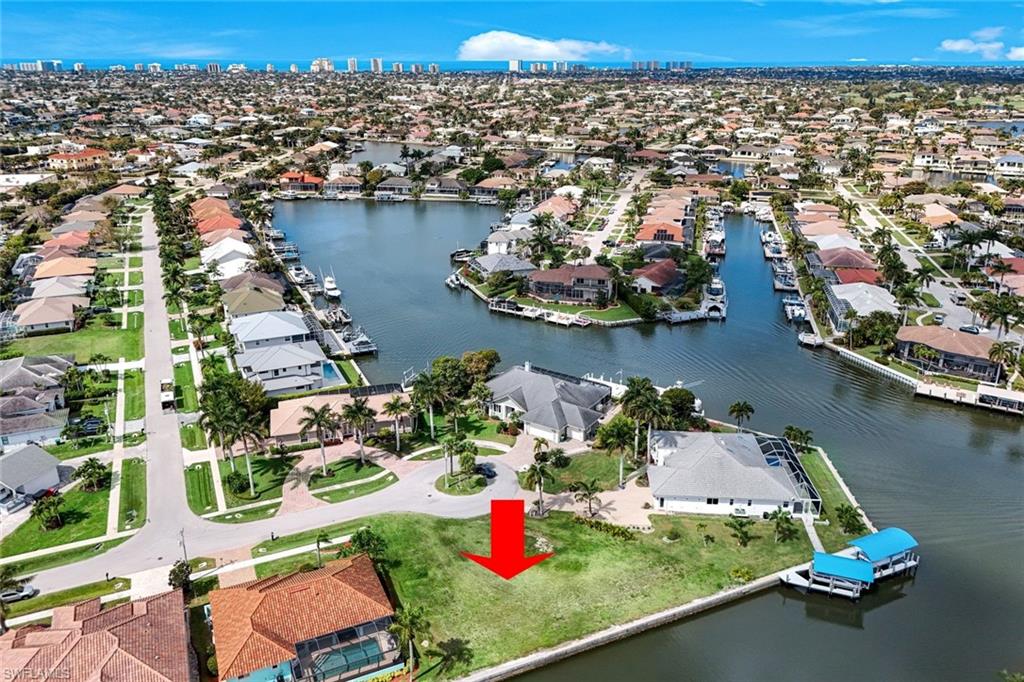 Aerial view of residential area with a large body of water