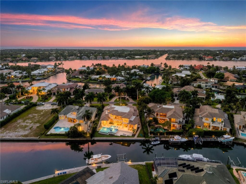 Aerial view at dusk of a water view and a residential view