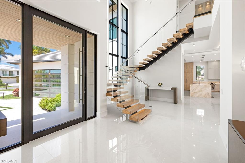 Foyer with a high ceiling and recessed lighting
