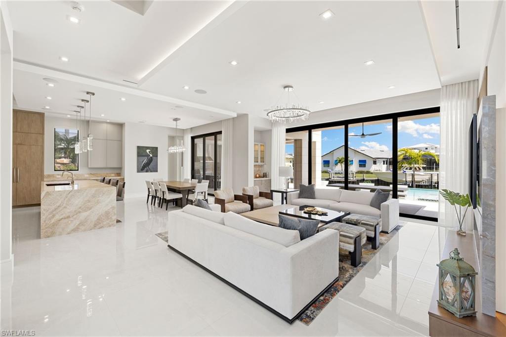 Living room featuring suspended lighting