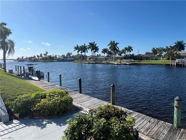 Dock area featuring a water view