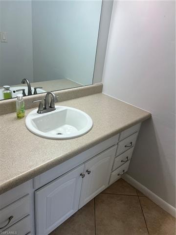 Bathroom featuring vanity and light tile patterned floors