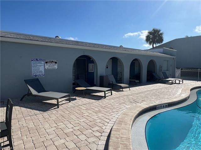 Community pool with a patio area