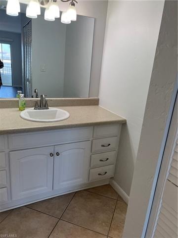 Bathroom featuring vanity and light tile patterned floors