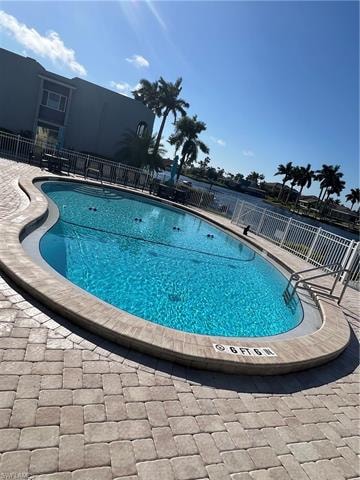 Community pool featuring a patio area