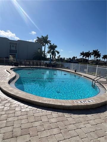 Community pool with a patio area