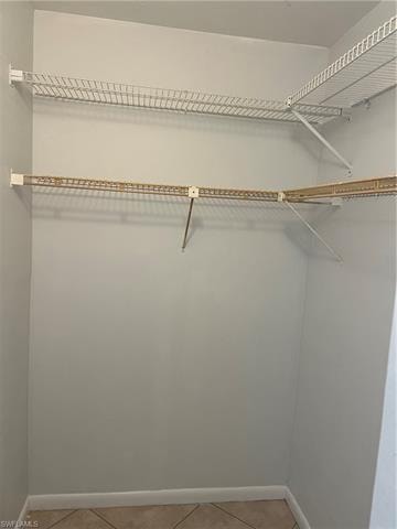 Walk in closet featuring light tile patterned floors